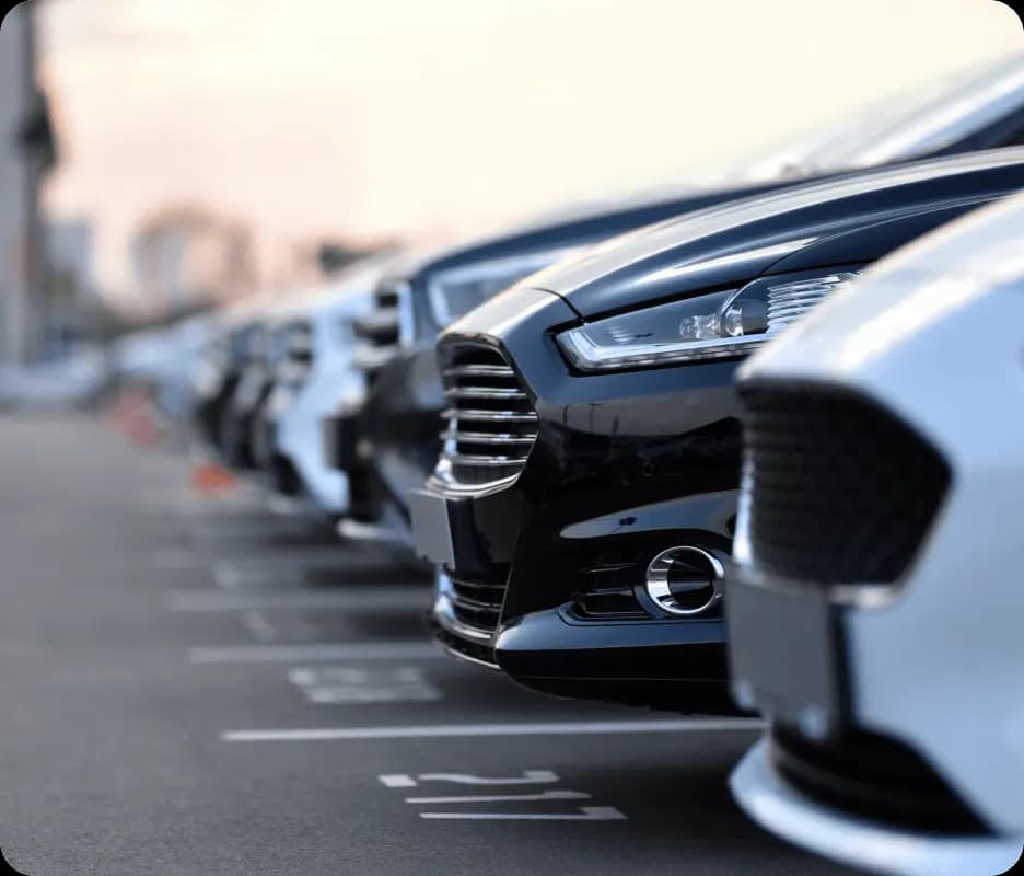 Row of parked cars in a parking lot